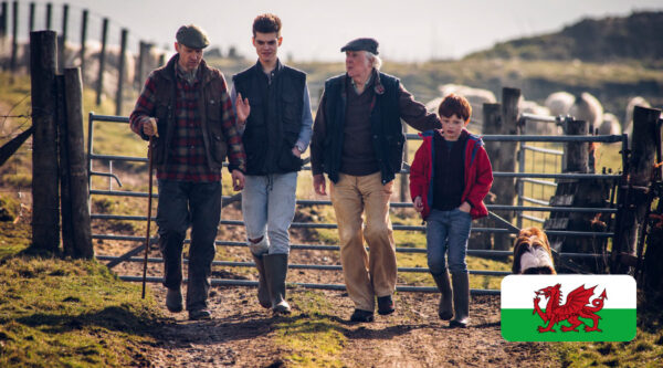 A farming family with a Welsh flag in the corner of the image
