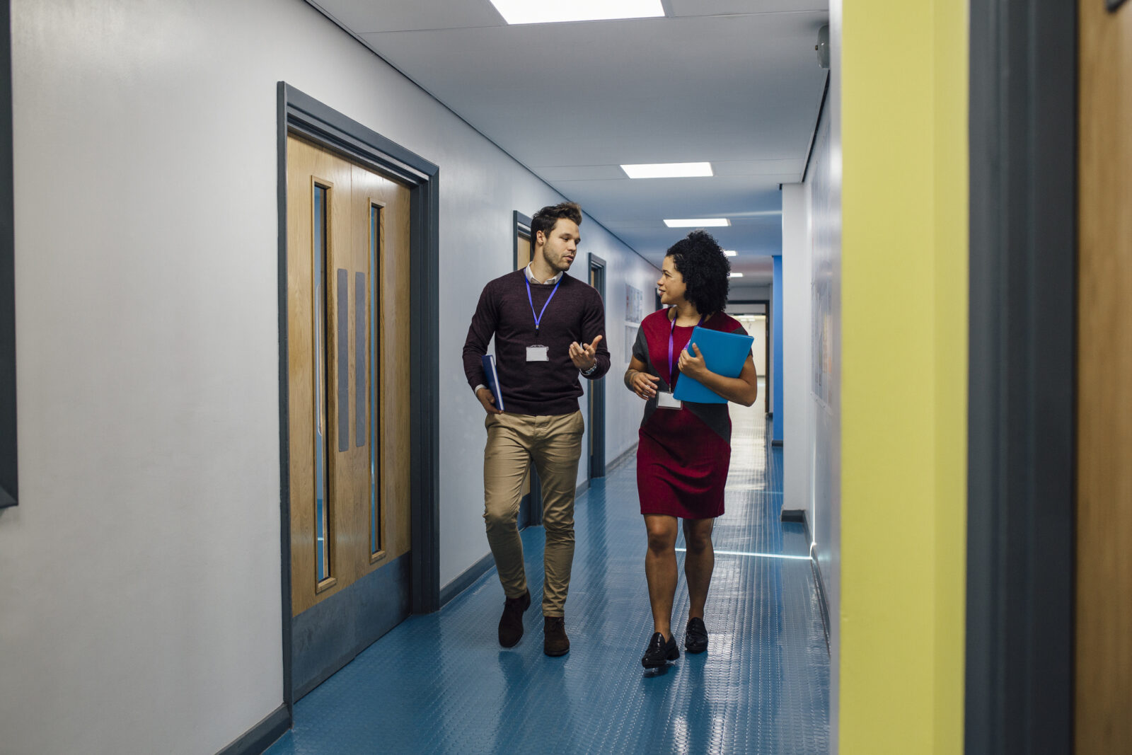 Employees walking down a corridor
