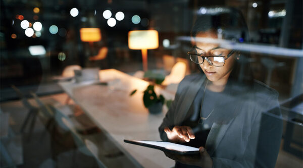 A businesswoman checking her company details on her phone