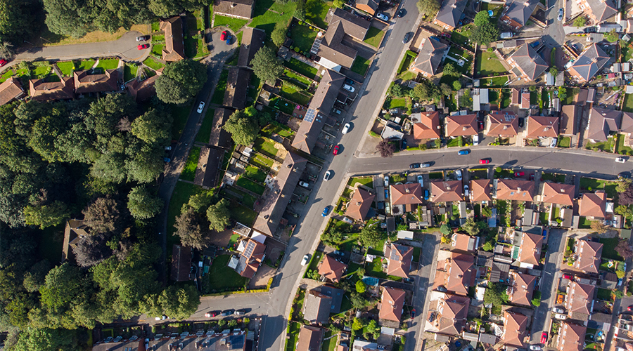 An aerial view of some plots of land with houses and property on