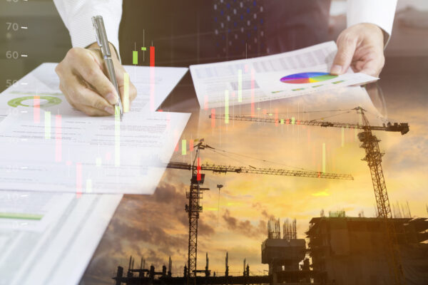 An image of construction cranes and planning documents