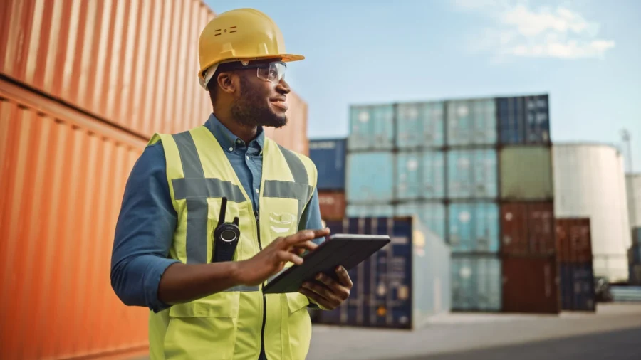 A man checking containers for a supply chain