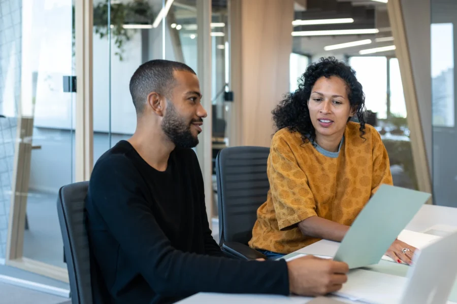 Two people discussing a property deal