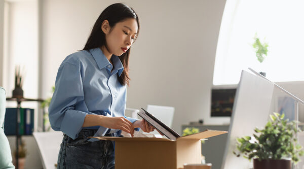 A lady packing her desk