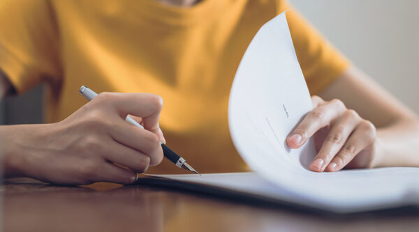 A person filling in a HR form