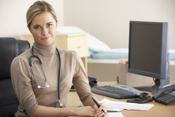 A doctor at her desk