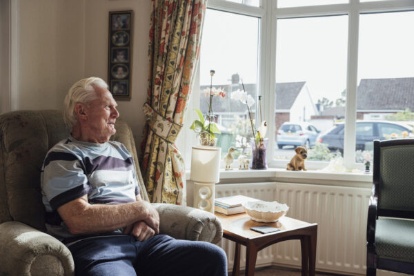 An older man in his house