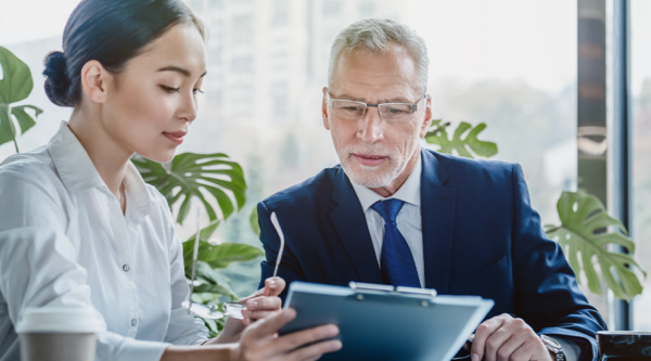 Two business people discussing liability limits