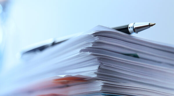 A stack of paper files