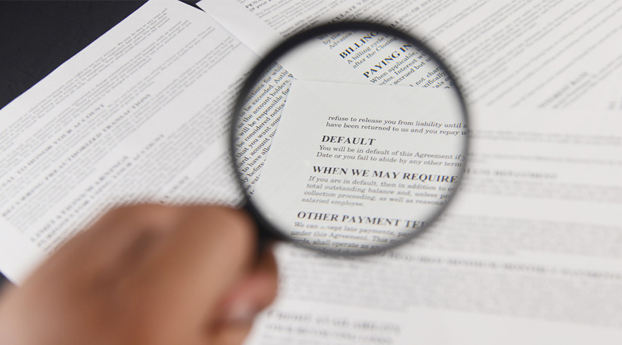 Magnifying glass over documents
