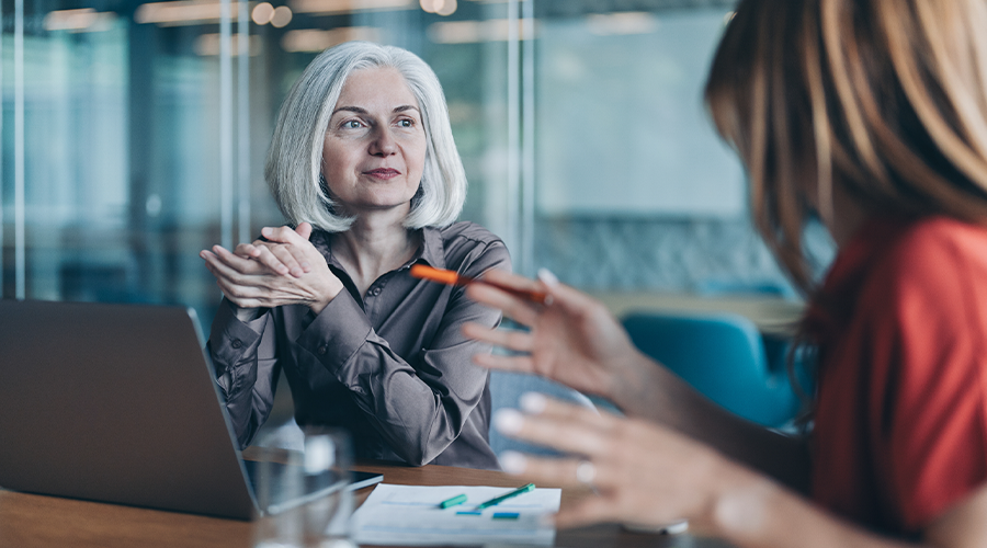 Group of people talking in an office