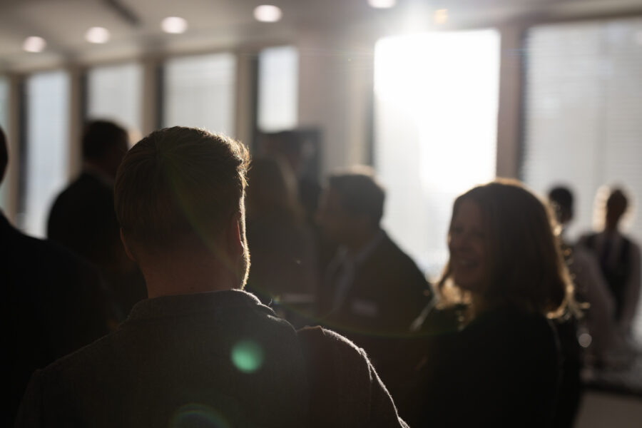 People networking at a cyber and technology event