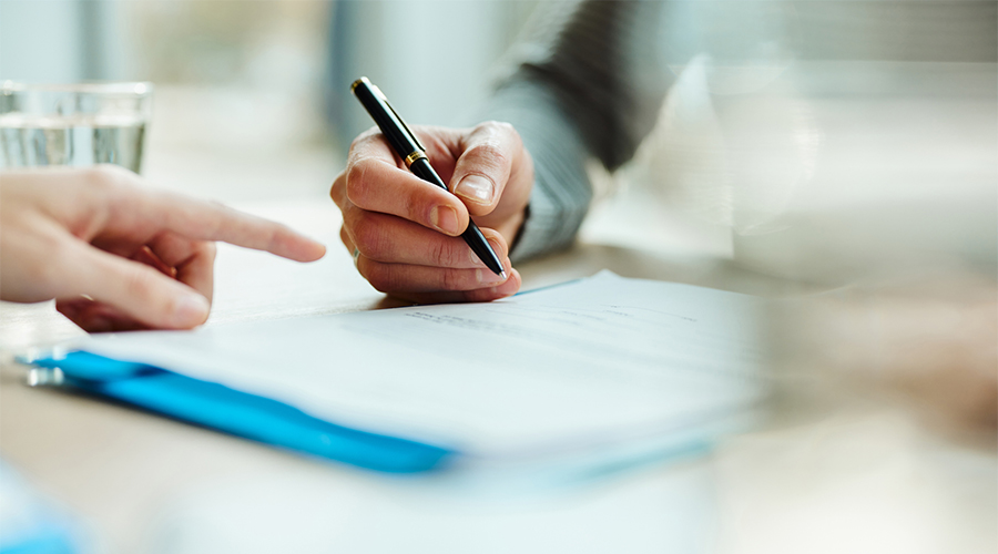 Man signing contract