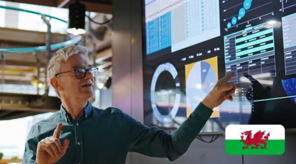 Man giving presentation in front of a big screen