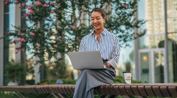 A businessperson on a laptop in spring