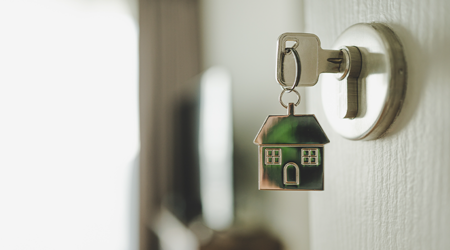 An image of a key in a door