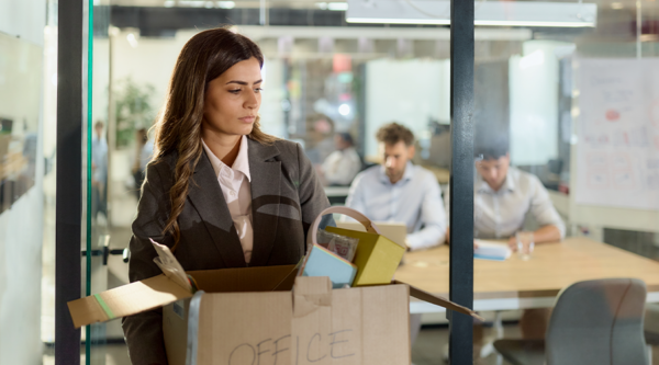 An employee packing a box