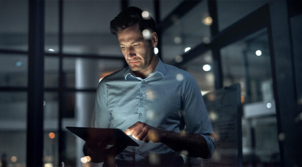A man checking AI on a tablet computer