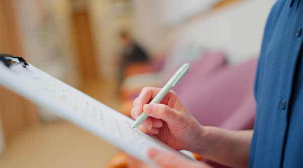 A nurse checking a report