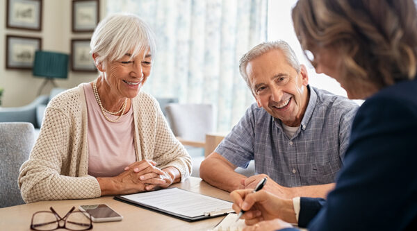 Elderly coupe talking to lawyer
