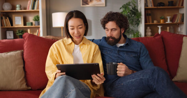 A family checking their wills on a computer tablet