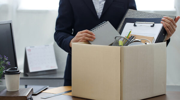 An employee packing a box