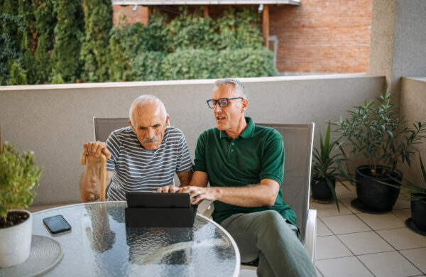 A caregiver and a patient checking a will