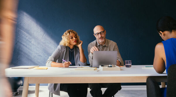 Two business owners reviewing their rent