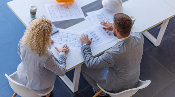 People planning a building at a desk