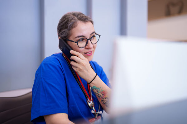 A healthcare worker on the phone