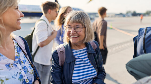Some older people at an airport