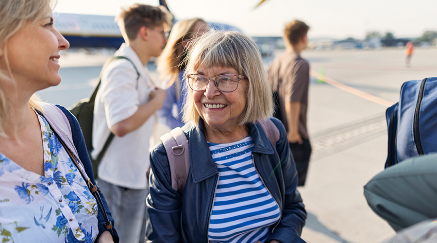 Some older people at an airport