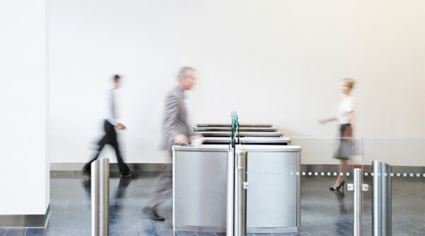 People using a security barrier