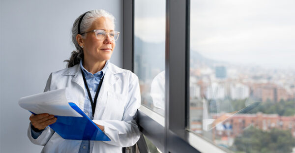 Medical professional looking out of the window