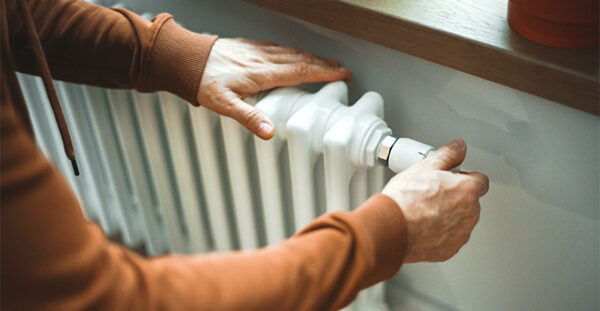 Someone altering the controls on a radiator