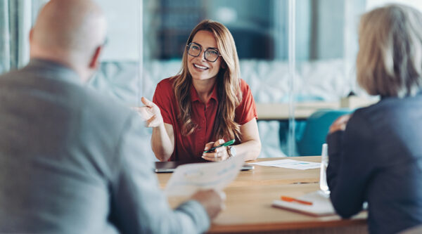 Three people in a meeting